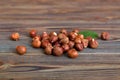 many fresh Hazelnut heap on wooden table, top view