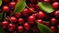 Many fresh perfect cherry in one heap with water drops and green leaves in top view. High detail aerial photography