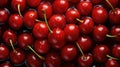 Many fresh perfect cherry in one heap with water drops without leaves in top view. High detail aerial photography