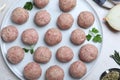 Many fresh raw meatballs on white table, flat lay Royalty Free Stock Photo