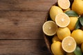 Many fresh ripe lemons on wooden table, top view. Space for text Royalty Free Stock Photo