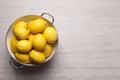 Many fresh ripe lemons on wooden table, top view. Space for text Royalty Free Stock Photo