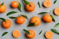 Many fresh ripe mandarin as colored background, top view. Elegant background of clementines and mandarin slices Top view