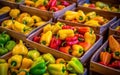 Many fresh yellow, green and red sweet bulgarian peppers in wooden boxes. Farmers market Royalty Free Stock Photo
