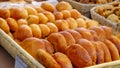 Many freshly baked buns in the basket. Top view bread. Pies freshly baked at the home producers' market