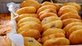 Many freshly baked buns in the basket. Top view bread. Pies freshly baked at the home producers' market