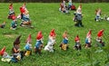 Many garden gnomes on grass Royalty Free Stock Photo