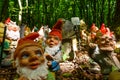 many garden gnomes on a place in the forest while hiking