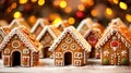 Many gingerbread houses on a festive table with bokeh lights in the background, Merry Christmas, Advent time, greeting Card.