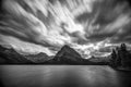 Many Glaciers Lake long exposure clouds in b&w