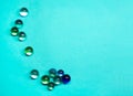 Many glass balls are scattered on a blue background. Royalty Free Stock Photo