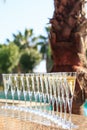 Many glasses of champagne or prosecco near resort pool in a luxury hotel. Pool party.