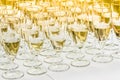 Many glasses of champagne on white table Royalty Free Stock Photo