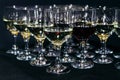 Many glasses of different wine on black bar counter Royalty Free Stock Photo