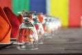 Many glasses of different wine in a row on a table.Rows of empty wine glasses on the showcase Royalty Free Stock Photo