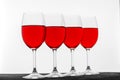 Many glasses of red French wine on a white background. Concept r Royalty Free Stock Photo