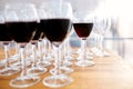 Many glasses with red wine and empty wine glasses Royalty Free Stock Photo