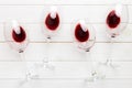 Many glasses of red wine at wine tasting. Concept of red wine on colored background. Top view, flat lay design Royalty Free Stock Photo