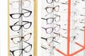 Many glasses rows at optical retail store. Rich assortment choice of different eyewear frames on eyeglasses shop display Royalty Free Stock Photo