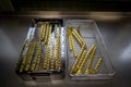 Many gold-colored titanium plates for the treatment of femoral fractures are stored in an instrument tray