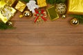 Many Gold gift box and wooden background