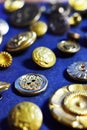 Gold sewing buttons on a blue background