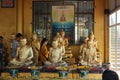 Many golden bronze Buddhas in the Thai temple, the concept of making merit and making merit