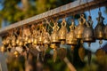 Many golden buddhist bells with sunlight Royalty Free Stock Photo