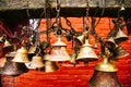 Many golden buddhist bells with wishes in sunlight Royalty Free Stock Photo