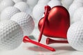 Many golf balls and red heart Royalty Free Stock Photo