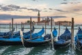 Many gondolas in Venice in Italy at sunset Royalty Free Stock Photo