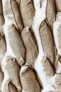 Many gray sandbag. Pattern closeup vertical background protection military design base