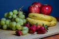 Many fresh fruits on a wooden board