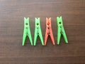 Green and orange color plastic Clothespins Royalty Free Stock Photo