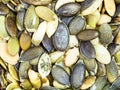 Many green peeled pumpkin seeds