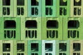 Many green stacked plastic beverage crates