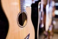many guitars in a music store at the display window Royalty Free Stock Photo