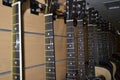 Many guitars in a row