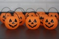 Many halloween pumpkins with scary faces looking forward