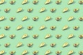 Many halves of avocado, pattern, banner. Preparation of a bright background, green mint pastel color