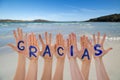 Many Hands Building Gracias Means Thank You, Beach And Ocean