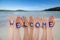 Many Hands Building Word Welcome, Beach And Ocean Royalty Free Stock Photo