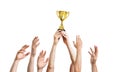 Many hands raised up. Winner is holding trophy in hands. Isolated on white background