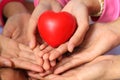 Many hands and a red heart Royalty Free Stock Photo