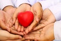 Many hands and a red heart Royalty Free Stock Photo