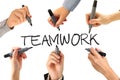 Many hands writing teamwork word Royalty Free Stock Photo