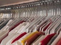 Many hangers with different clothes in the store Royalty Free Stock Photo