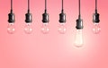 Many hanging lamp bulbs. Symbol of idea and solution Royalty Free Stock Photo