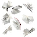 Many hardcover books falling on white background