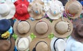 Many of hats hang on grille for sale in market Royalty Free Stock Photo